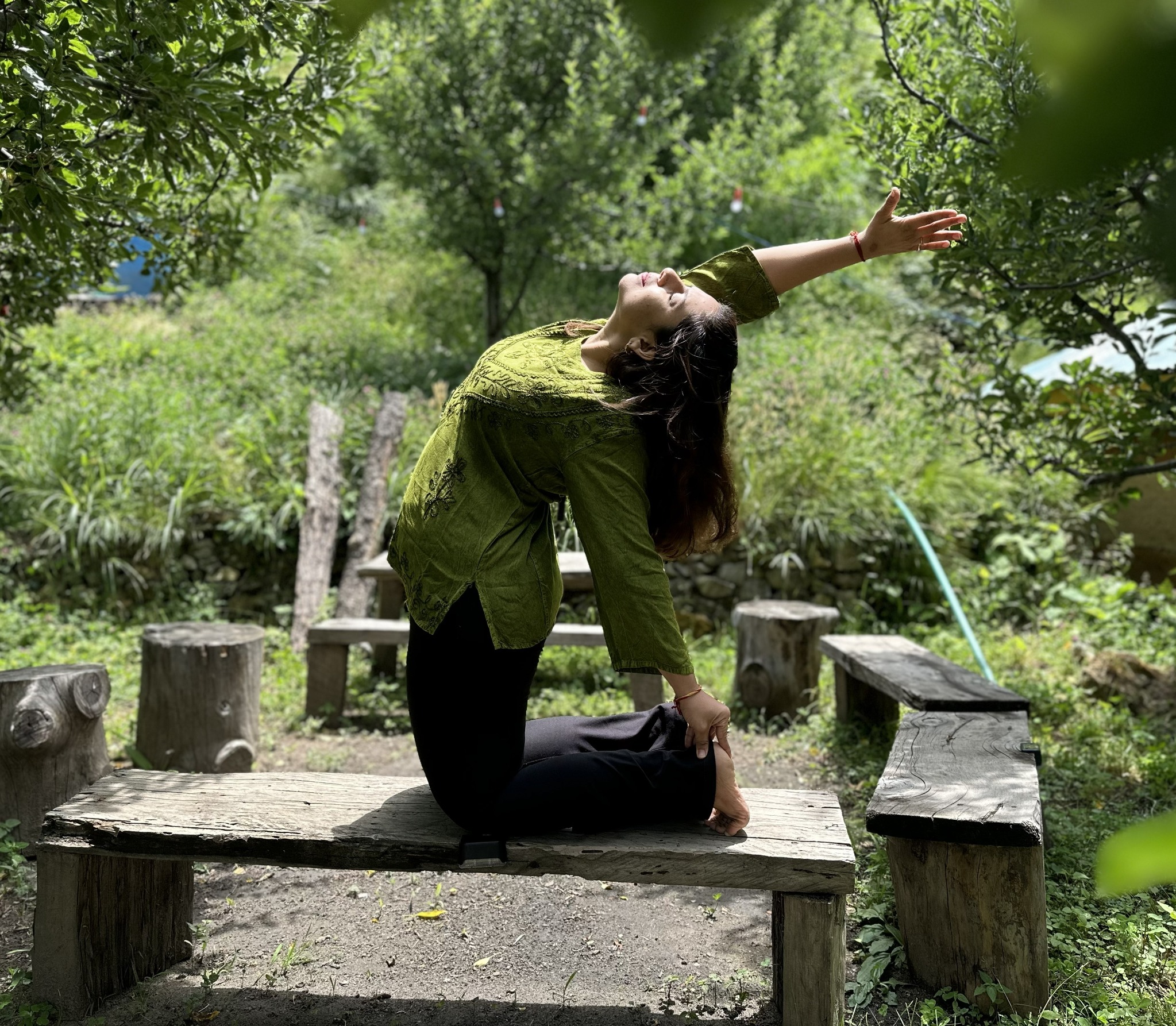 Charmi Pandit practicing yoga outdoors